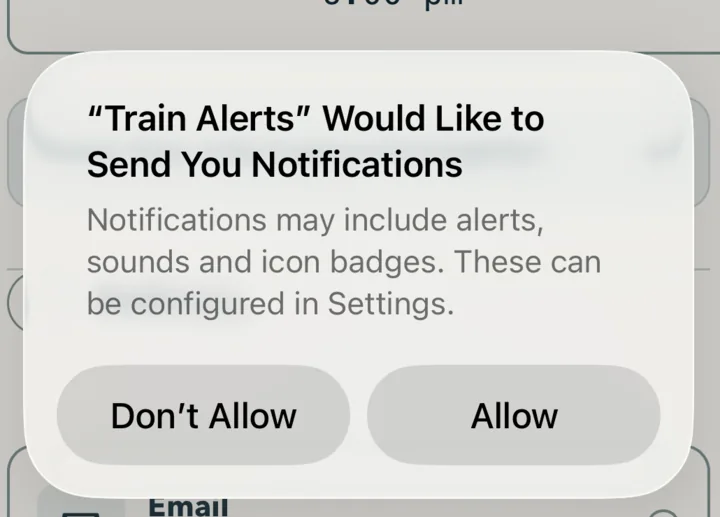 The iOS permission dialog reading Train Alerts Would Like to Send You Notifications, with Don't Allow and Allow buttons.